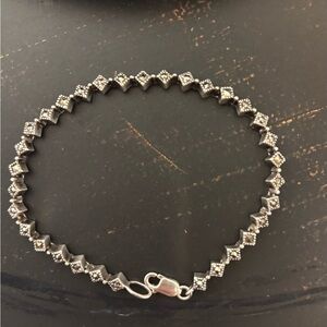 Dazzling Sterling Silver Bracelet with Intricate Detailing. Stamped 925.